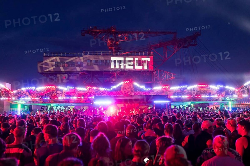 Festival visitors celebrate between bumper cars and excavators at the Melt Festival in Ferropolis on 12 July 2024. After a total of 27 years, the festival will take place for the last time in 2024