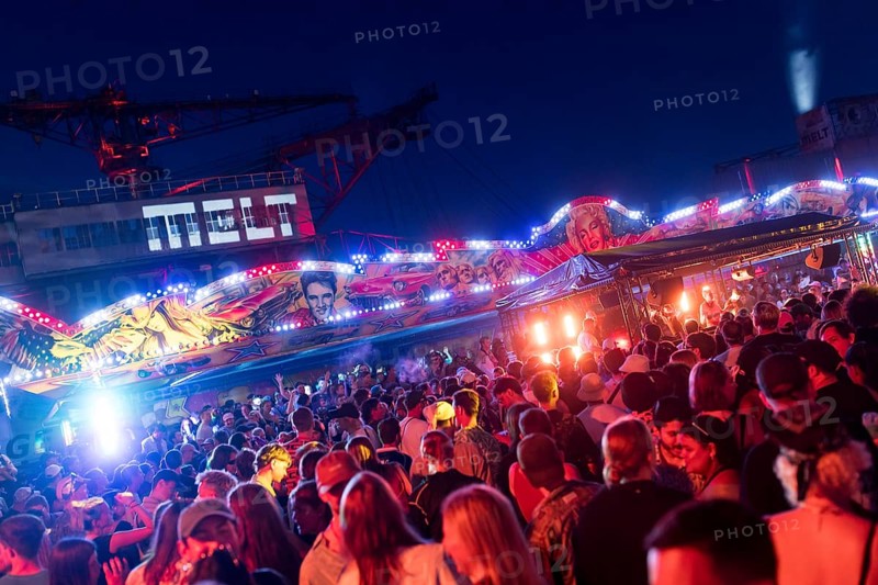 Festival visitors celebrate between bumper cars and excavators at the Melt Festival in Ferropolis on 12 July 2024. After a total of 27 years, the festival will take place for the last time in 2024