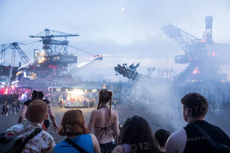 Festival visitors between excavators at the Melt Festival in Ferropolis on 12 July 2024. After a total of 27 years, the festival will take place for the last time in 2024