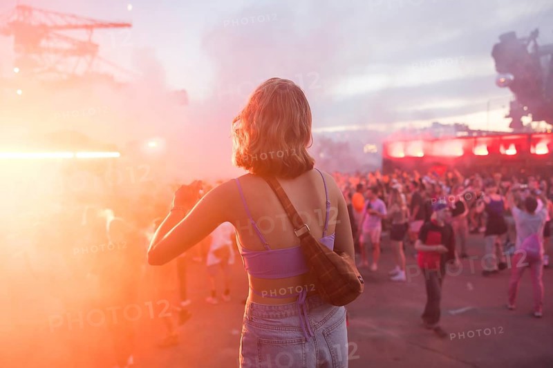 Dancing festival visitor in the evening at the Melt Festival in Ferropolis on 12 July 2024. After a total of 27 years, the festival will take place for the last time in 2024