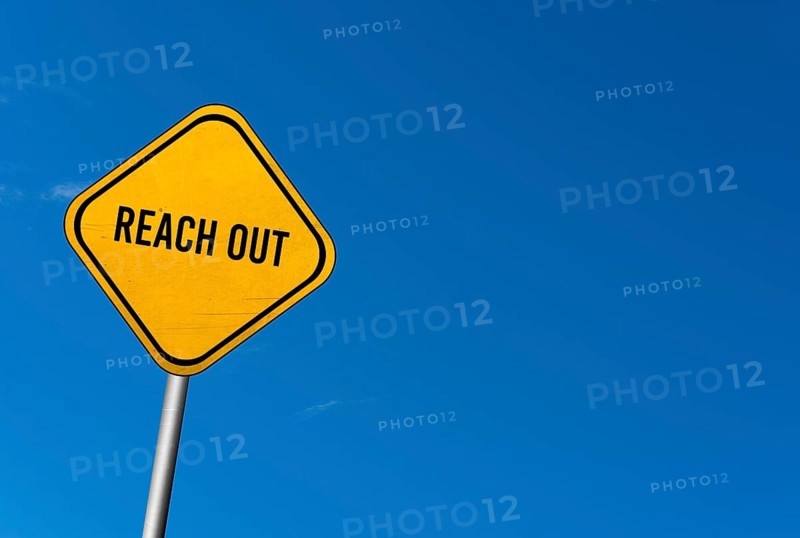 Reach out, yellow sign with blue sky