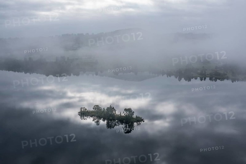 Aerial view over lake Rottachsee to village Petersthal, island in the lake, fog on the lake, Allgäu, Bavaria, Germany, Europe