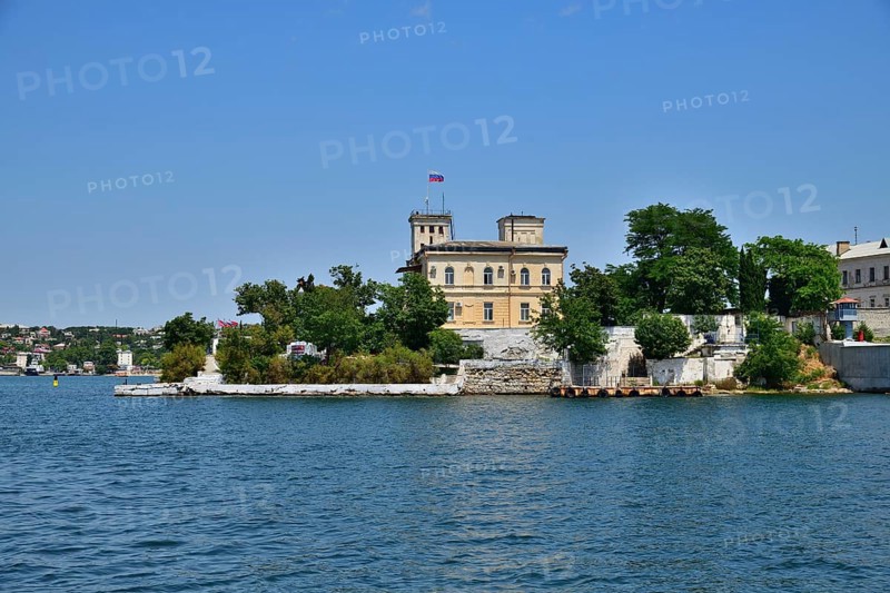 Sevastopol, Crimea, July 3, 2019. The building of Naval Hospital, founded in 1783 and monument to a destroyer Svobodny on Pavlovsky Cape