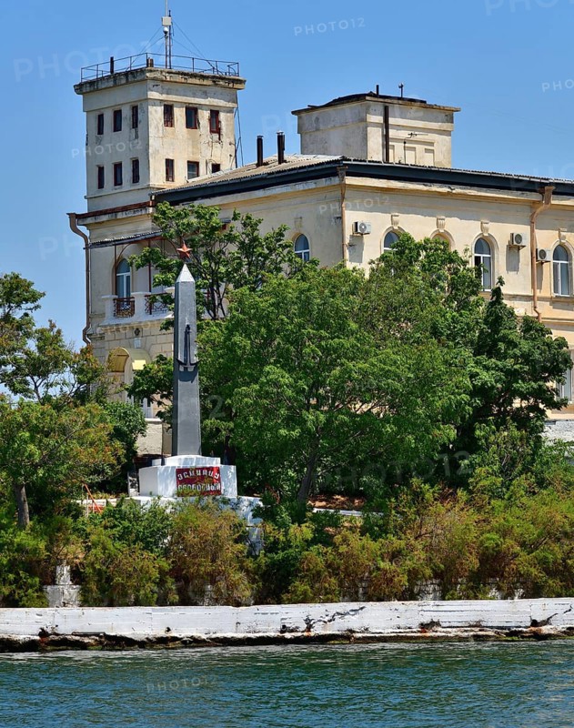 Sevastopol, Crimea, July 3, 2019. The building of Naval Hospital, founded in 1783 and monument to a destroyer Svobodny on Pavlovsky Cape