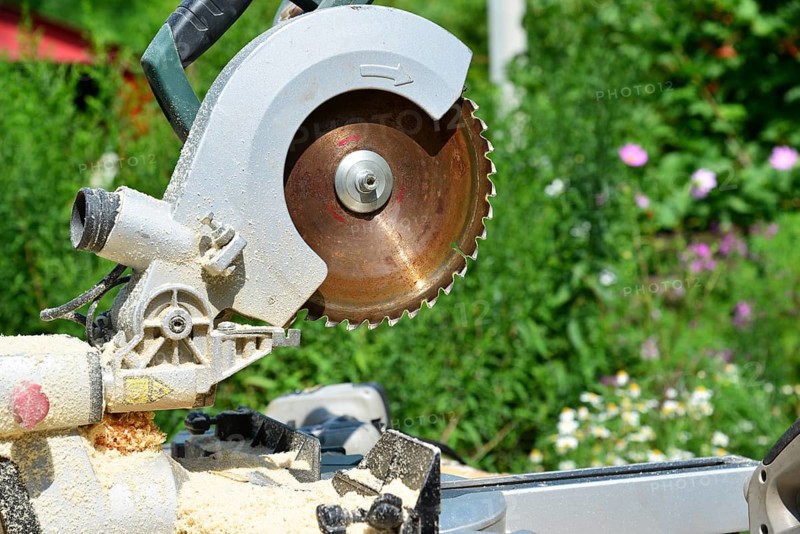 Circular saw and on the background of nature in summer