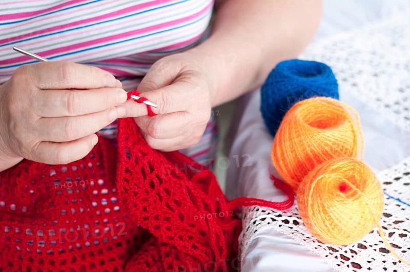 Women's hands are knitted shawl