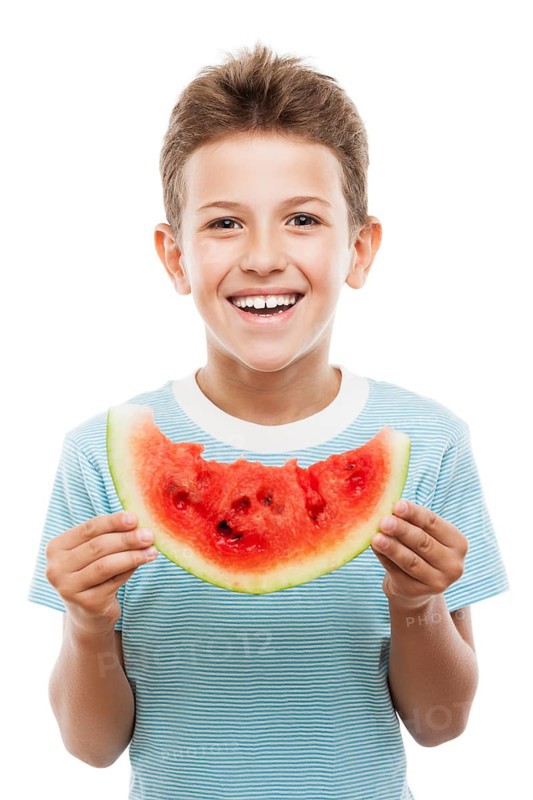 Handsome smiling child boy hand holding red ripe watermelon fruit food slice white isolated