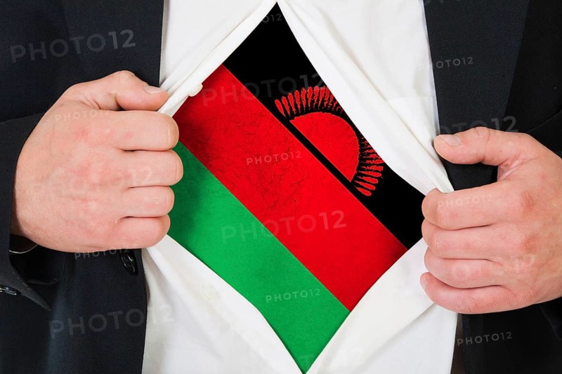 The Malawi flag painted on the chest of a man