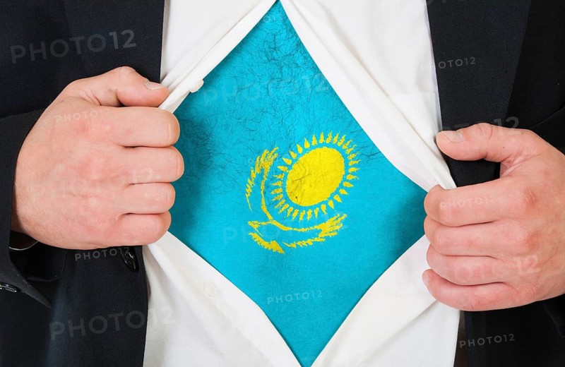 The Kazakh flag painted on the chest of a man