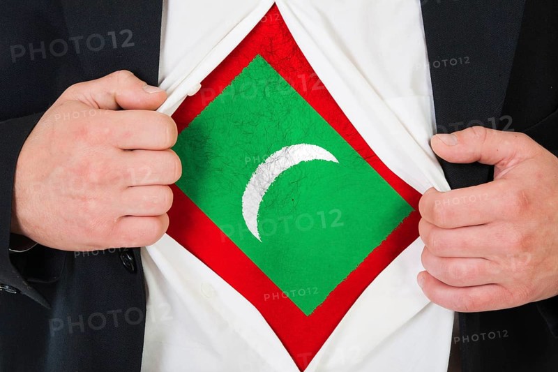 The Maldives flag painted on the chest of a man