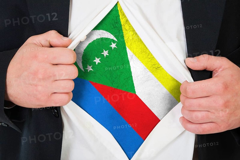 The Comoros flag painted on the chest of a man