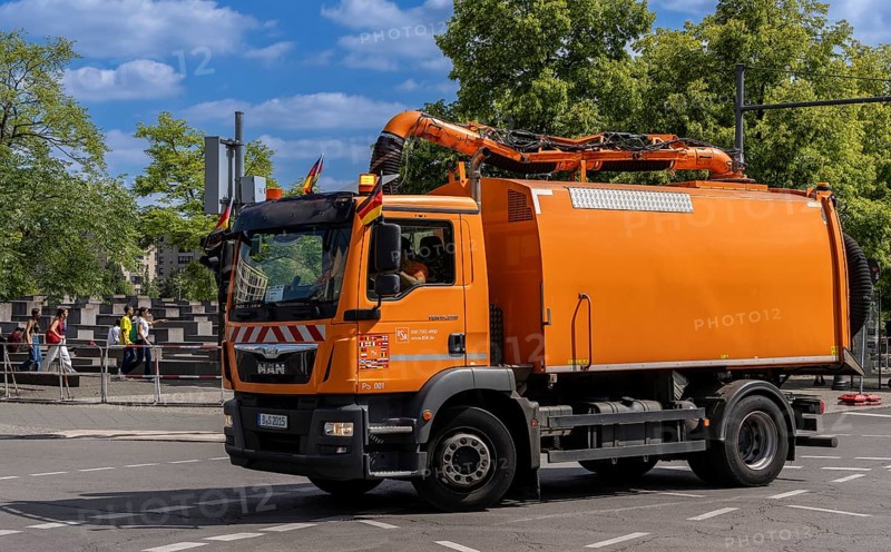 Operational vehicle of the Berlin city cleaning service with German flags on the driver's cab, Berlin, Germany, Europe