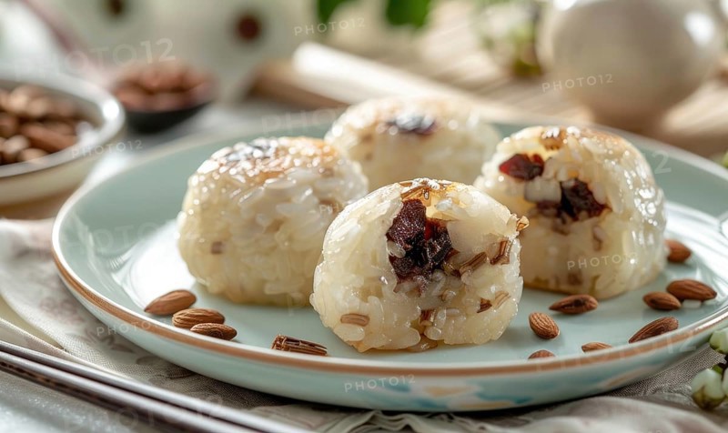 Chinese sweet rice cakes with red bean on a pastel green plate AI generated