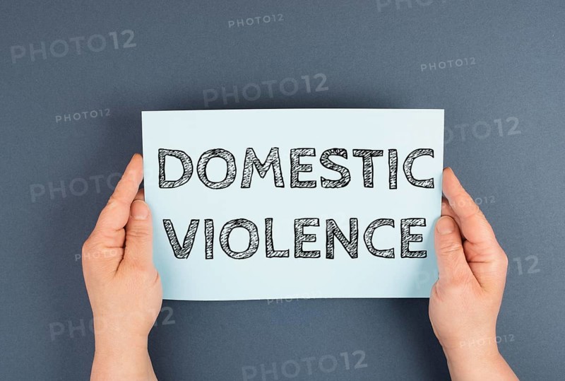 Domestic violence is standing on the paper, international awareness month october for victims and survivors