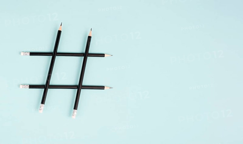 Hashtag made from pencils, social media communication, influencer and followers, viral content trend
