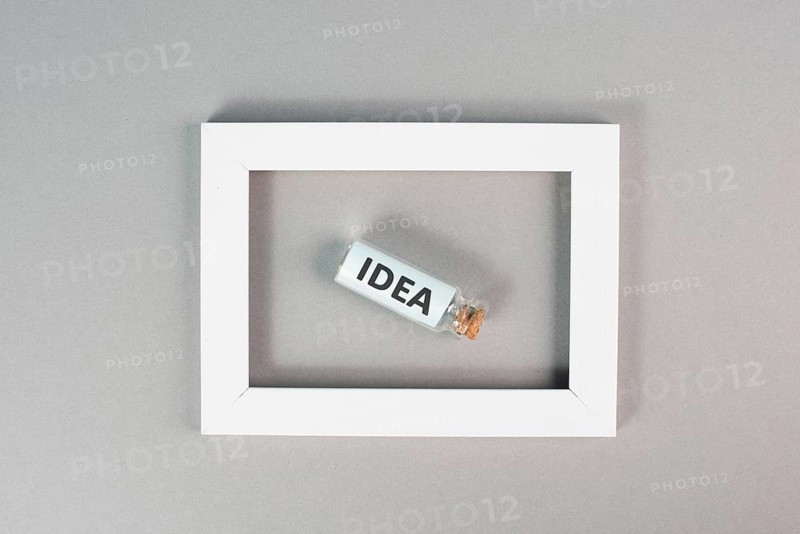 Idea is standing in the glass bottle in the frame, brainstorming concept, solving a problem, starting a business