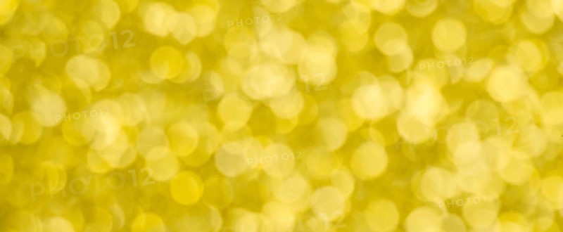 Golden bokeh background for christmas, defocused round lights and sunbeams, flare overlay