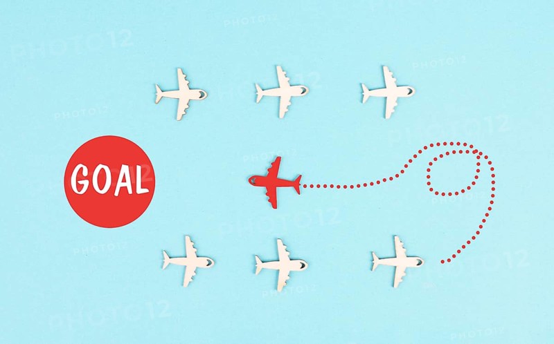 Red airplane is following his goal, leadership, courage and winner concept, standing out from the crowd, positive mindset for success in business
