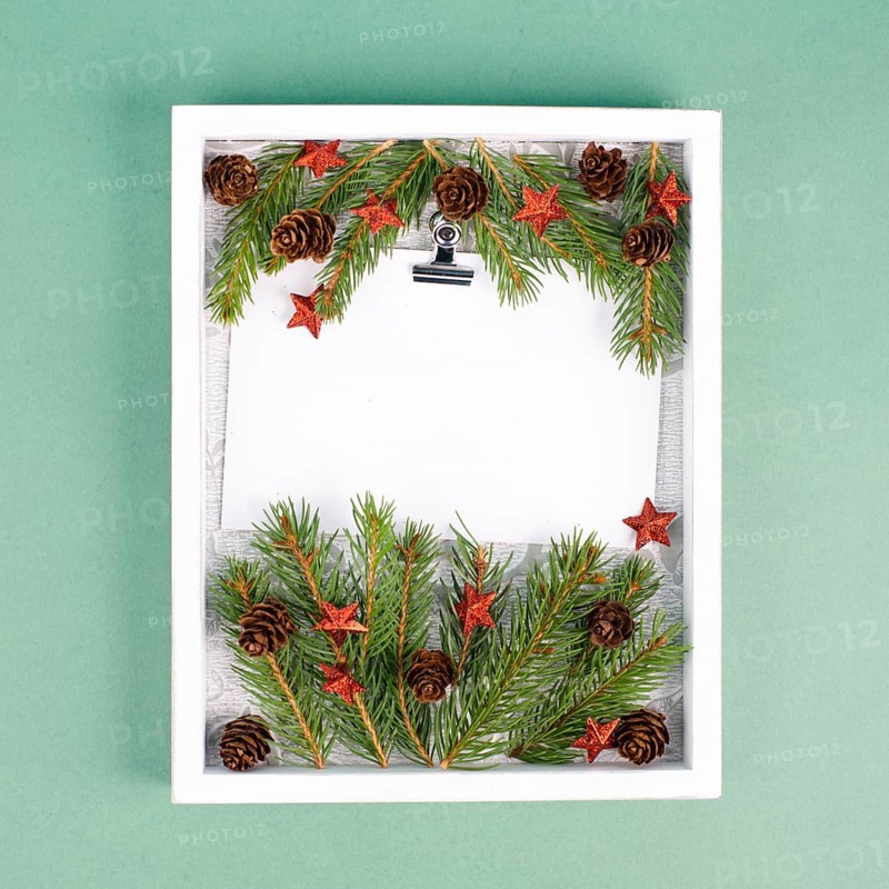 Christmas holiday background, frame with fir branches, stars, candy cane and pine cones, winter season greeting card