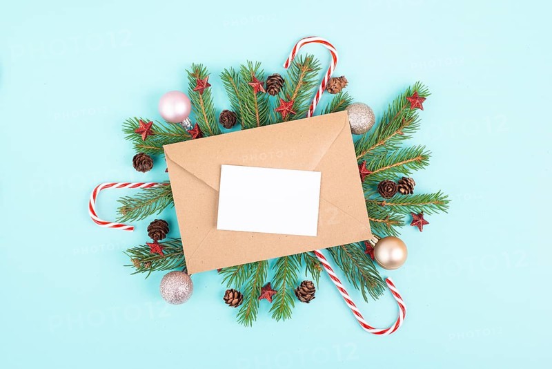 Christmas holiday background, frame with fir branches, baubles, candy cane and cones, winter season greeting card