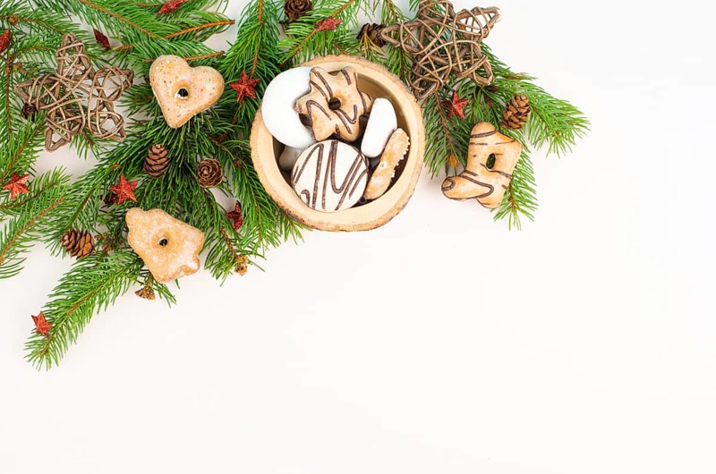 Nurnberg elisen gingerbread mix, traditional german christmas sweets with fir branches and pine cones, holiday background with copy space