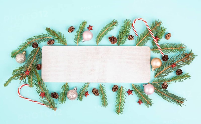 Christmas holiday background, frame with fir branches, baubles, candy cane and cones, winter season greeting card
