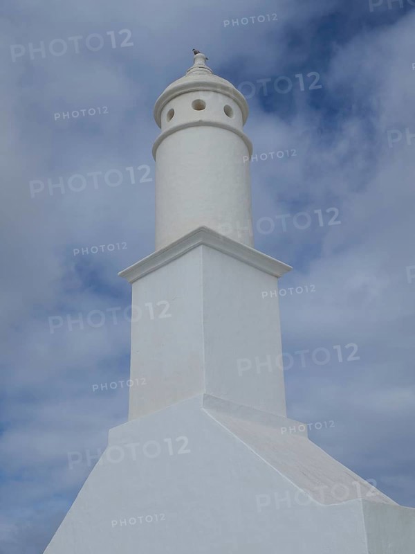 Lighthouse with a tower-shaped building under a cloudy sky in Lanzarote, arrecife, Lanzarote, Canary Islands, Spain, Europe