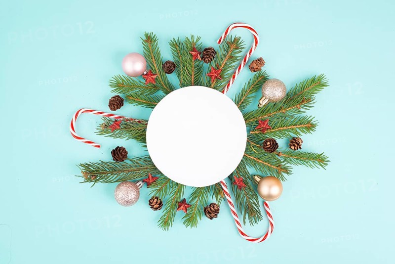 Christmas holiday background, frame with fir branches, baubles, candy cane and cones, winter season greeting card