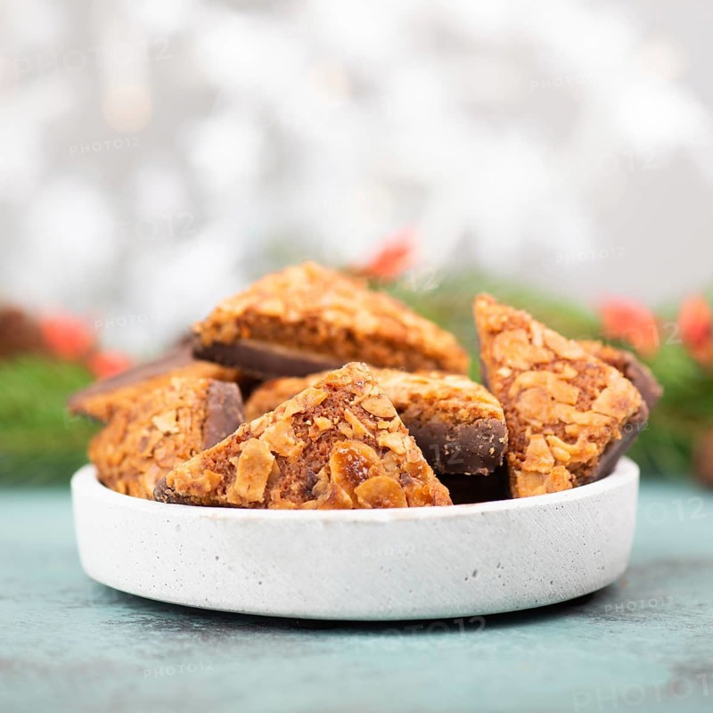 Nut corner triangles, traditional german sweets called Nussecke, covered with chocolate, christmas cake