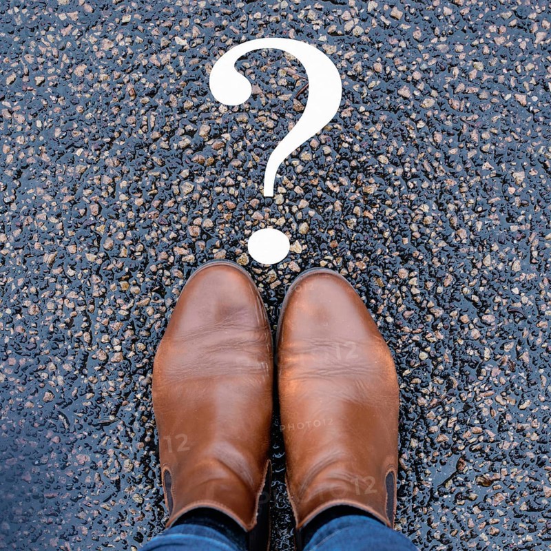 Woman is thinking, question mark on the road, brainstorming and looking for answers, solving a problem, making a decision, business and education concept