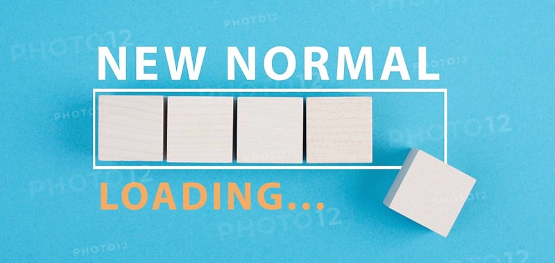 The words new normal are standing next to the loading bar, old and new life, time for a change