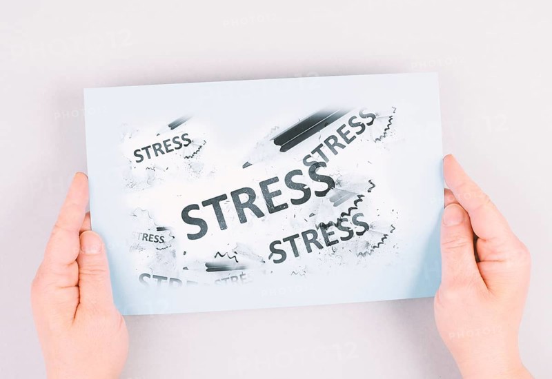 The word stress is standing on a paper, pen with eraser, burnout concept, work life balance, breakdown by exhaustion
