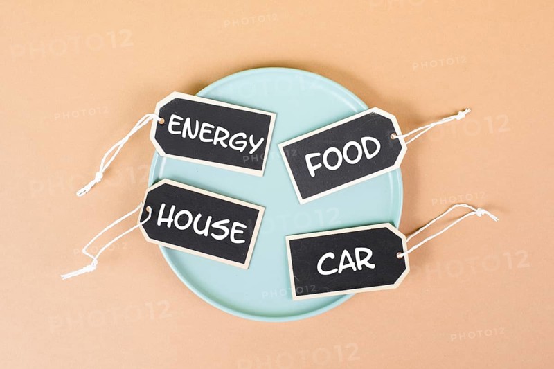 Global increasing prices, high living expenses, food, house, car and energy costs standing on tags, empty plate, inflation