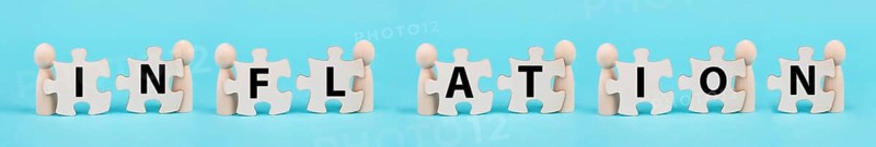 Men holding the letters for the word inflation, financial crash, economy development and increasing prices, high living costs
