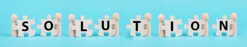 The word solution is standing on puzzle pieces, working as a team together to reach a goal, connecting the parts together