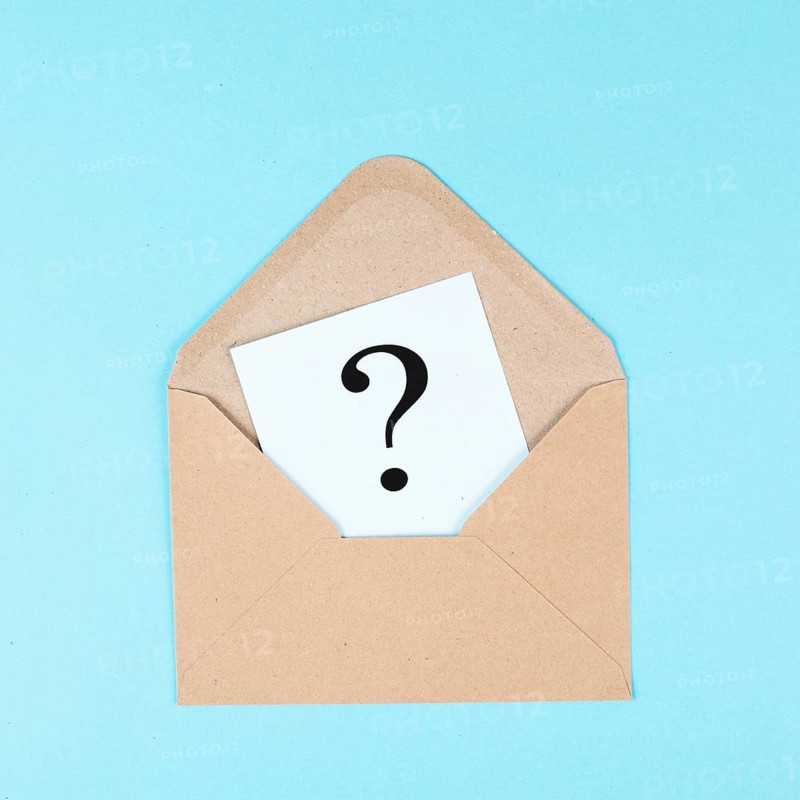 Question mark on a paper in an envelope, education and business concept, searching for answers, thoughts for solving a problem, having doubts