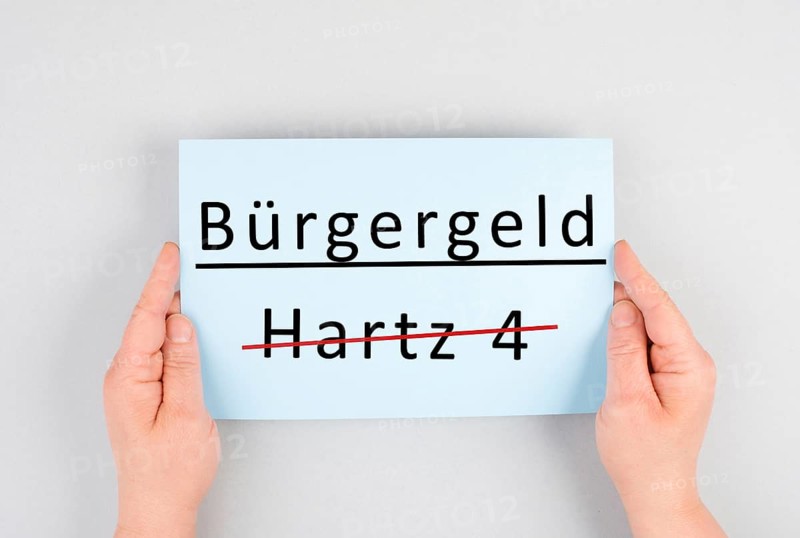 The german word for citizen money is standing on a paper, Hartz 4 is crossed out, new financial help system for unemployment in Germany, social issue