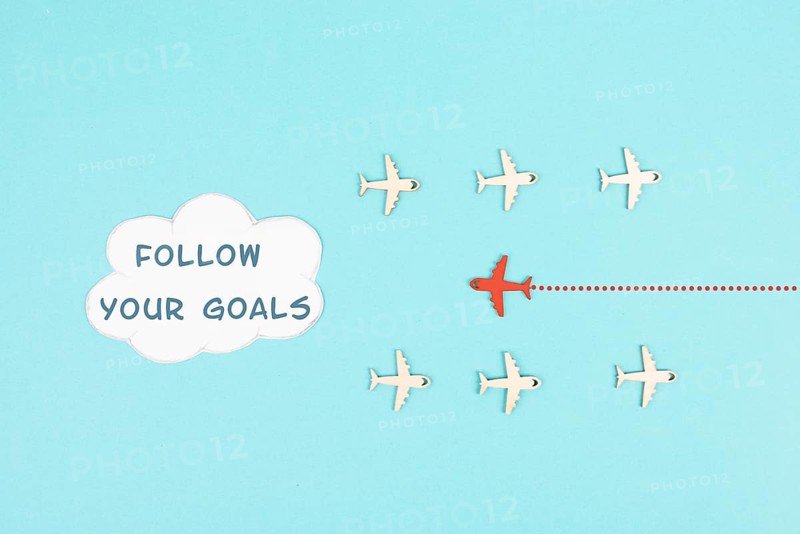 Red airplane is following his goal, leadership, courage and winner concept, standing out from the crowd, positive mindset for success in business