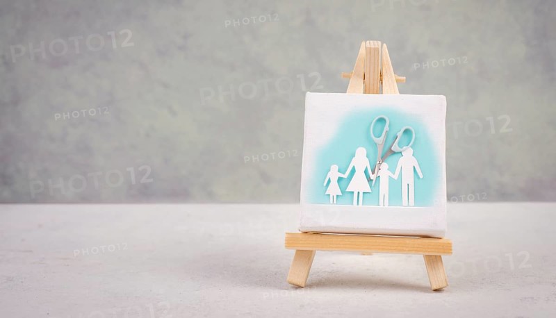Divored parents, custody battle for the children, scissors cut the family, paper cut out, conflict in relationship, broken marriage concept