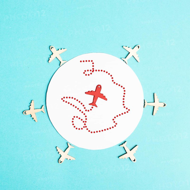 Red airplane in the middle tries to find an exit, searching for freedom, think outside the box, be different, finding a strategy, leadership concept