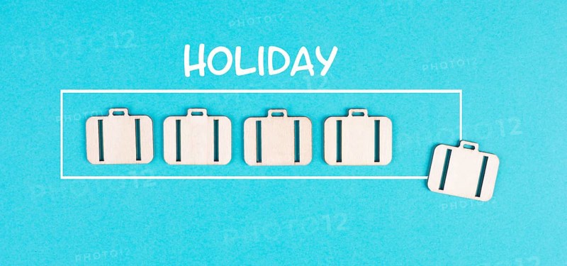 Progress bar with suitcases, holiday loading ist standing on the paper, planning a trip for the weekend, vacation and travel concept