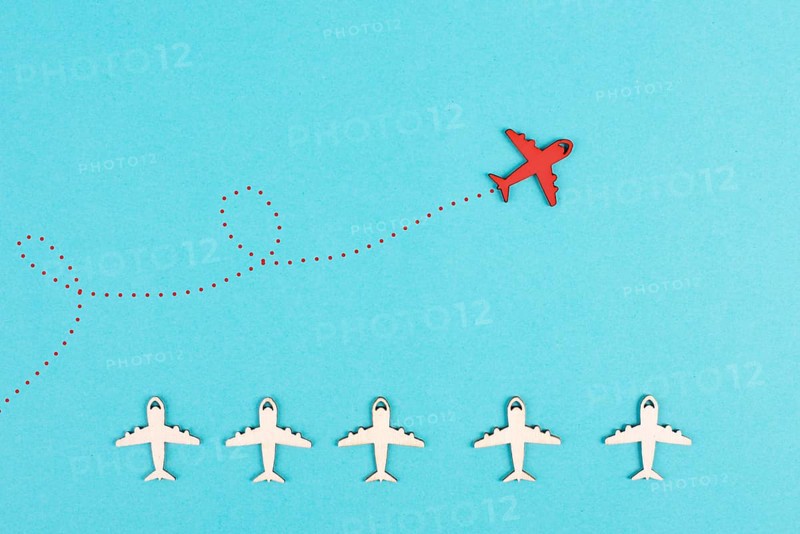 Red airplanes takes a different direction, leadership and business concept, follow your dreams, motivation and coaching, positive thinking, having a goal, mindset of freedom