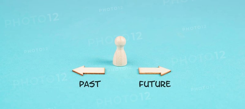 Arrows show to different directions, past and future, progress and development, taking a new path, opportunity for a new beginning, making a decision