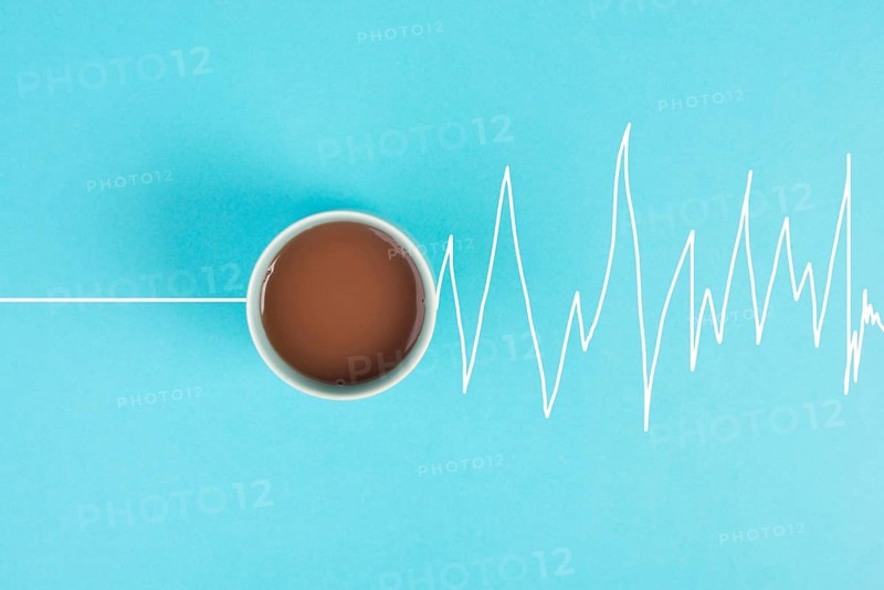 Cup of coffee in the morning, wake up, heartbeat goes up after the caffeine drink, take a break, high energy, medical risk