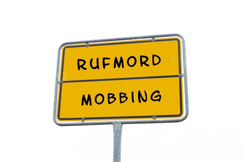 Sign with the words mobbing and character assassination in german language, cancel culture, social bullying, free speech