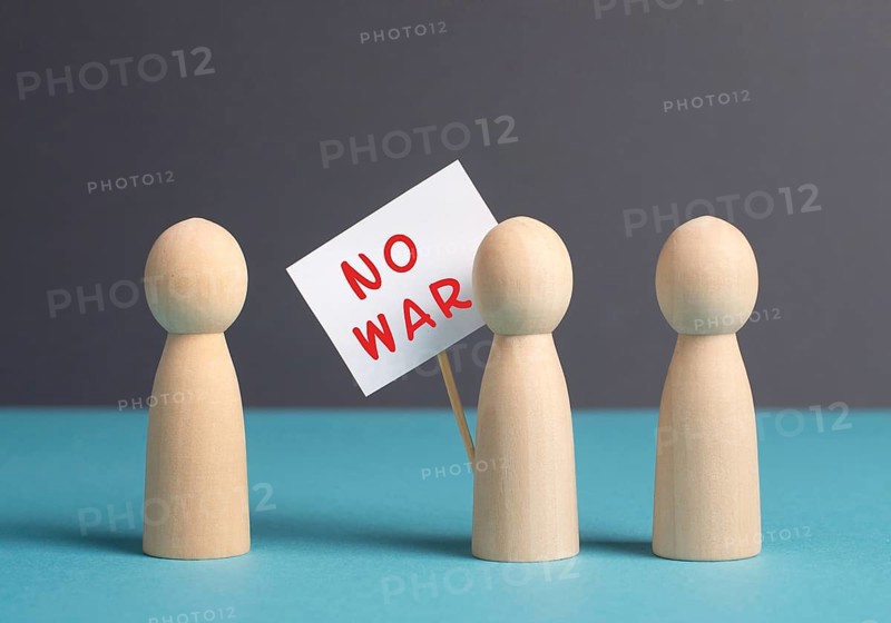 Group of protesters holding a sign with the words no war, demonstration for human right and freedom, political movement, activists for peace