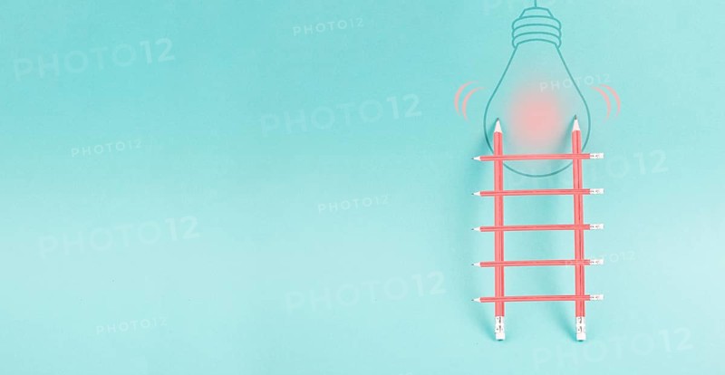 Ladder of success, having an idea, marketing and business concept, brainstorming for new goals, light bulb on wall