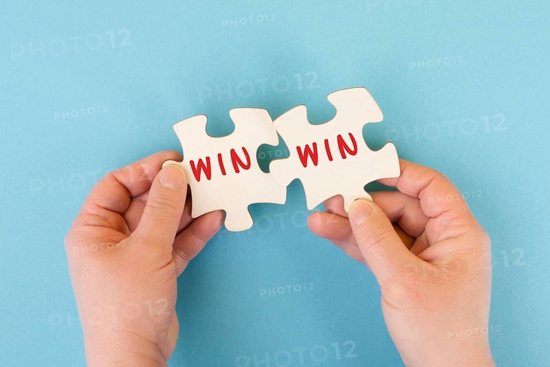 The word win is standing on puzzle parts, problem solving, winner mindset, business and education concept, coaching and motivation