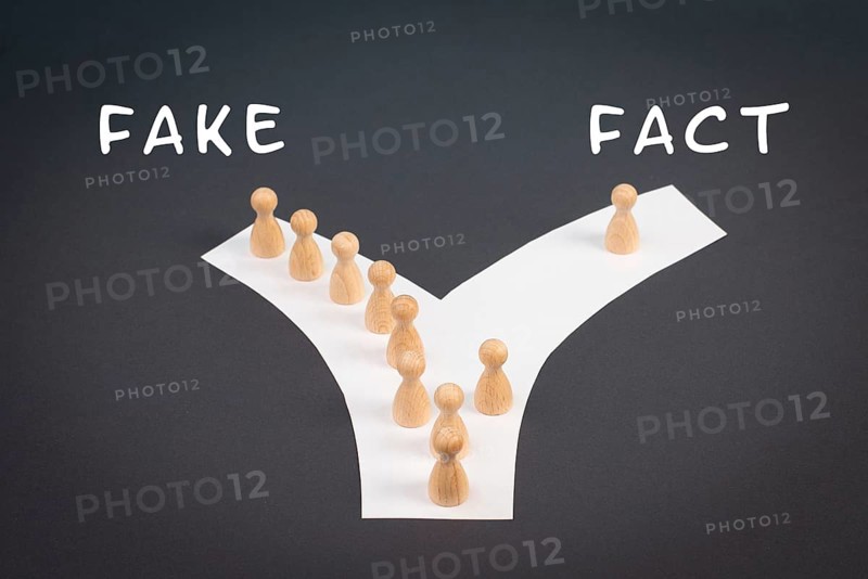Crowd of people follow the path to the fake information, one thinks different and takes his own way and decisions, propaganda and conspiracy theory concept, media and manipulation issue