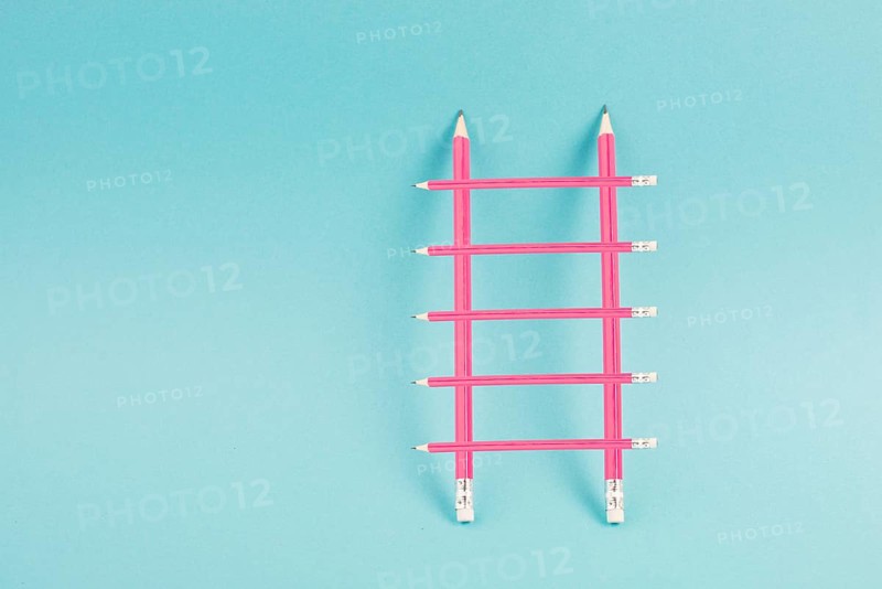 Ladder of success build with pencils, opportunity strategy, blue background, copy space for text, step by step concept, progress in business and education, have a goal